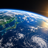 明るい地球と太陽の周囲に広がる黒い宇宙のイメージ